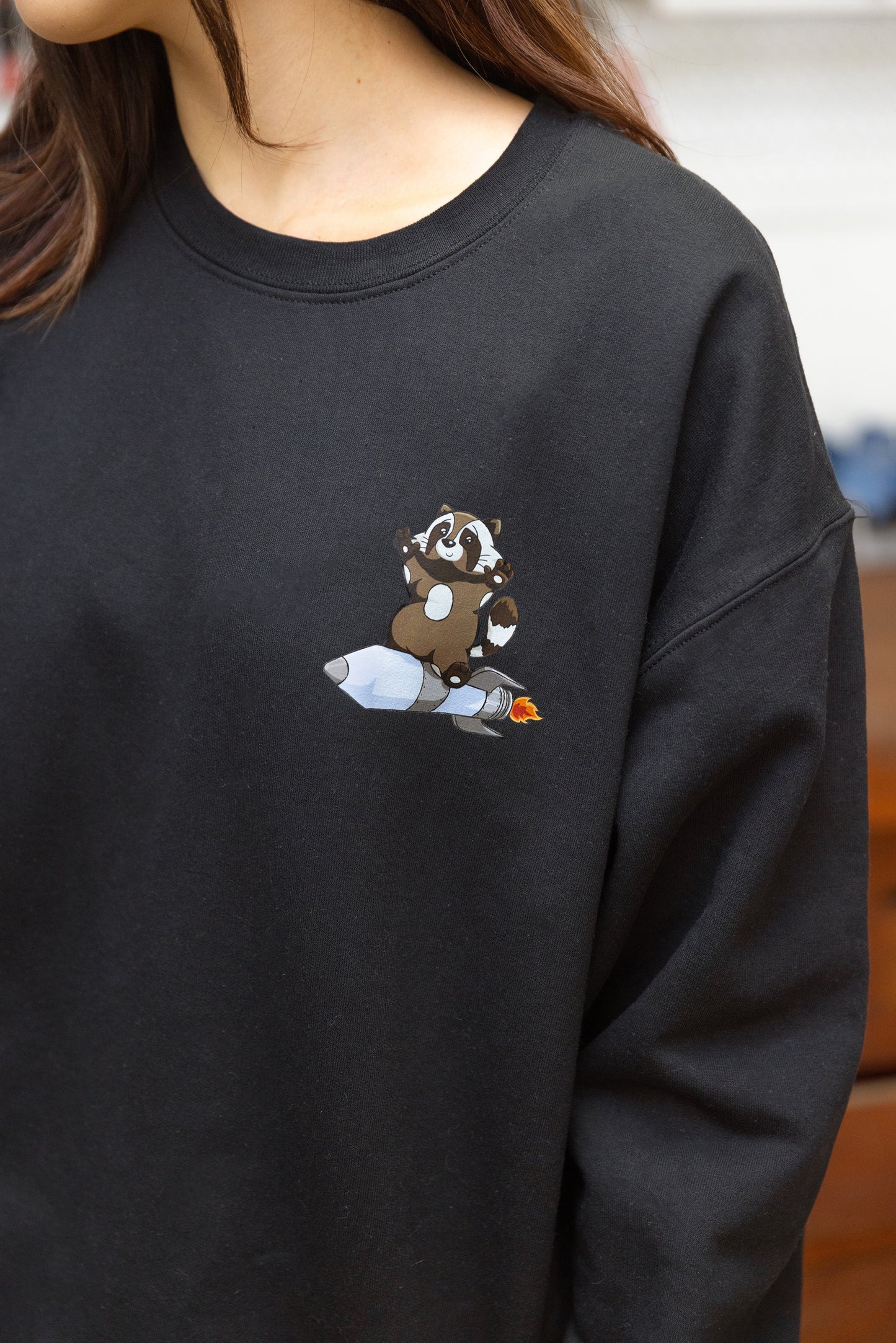 Raccoon on a Rocket on a Pocket Crew Sweatshirt